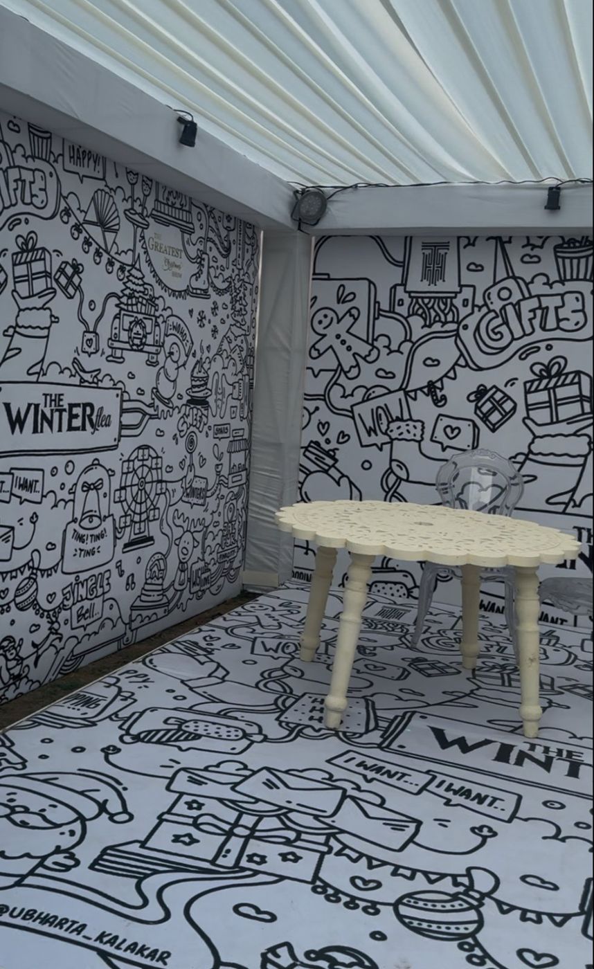 Framed doodle prints on a wall